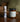 Watercolor match tube and Cascade Forest candle displayed on a wooden surface in a cozy, natural setting.