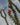 Close-up of a blooming Ocotillo plant with red-orange flowers against a soft desert sky