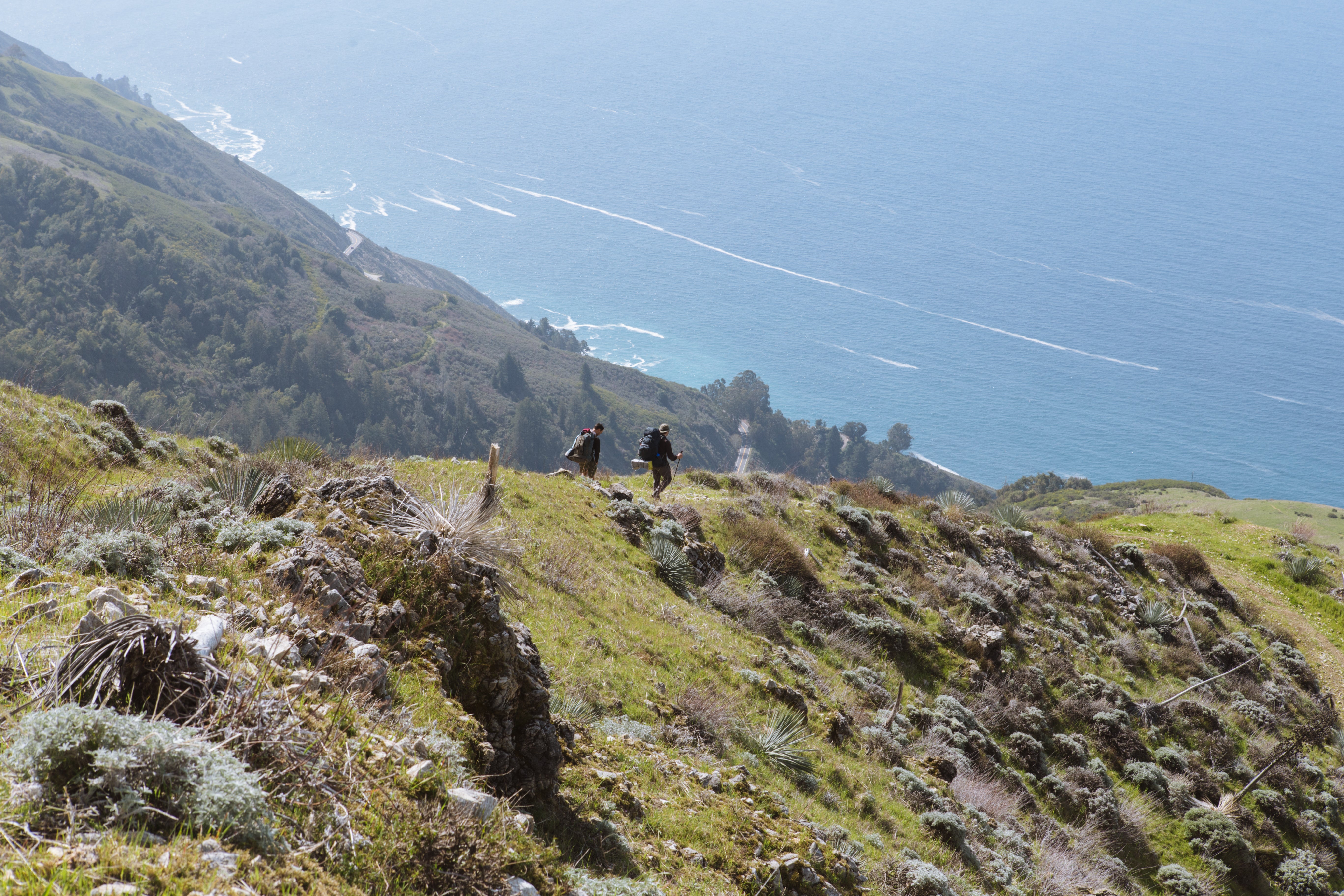 Juniper Ridge Crew Hiking Along A Coastal Ridgeline