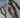 Close-up of a blooming Ocotillo plant with red-orange flowers against a soft desert sky