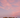 Soft pink sunset over desert rocks, evoking the gentle, natural essence of rose and sage.